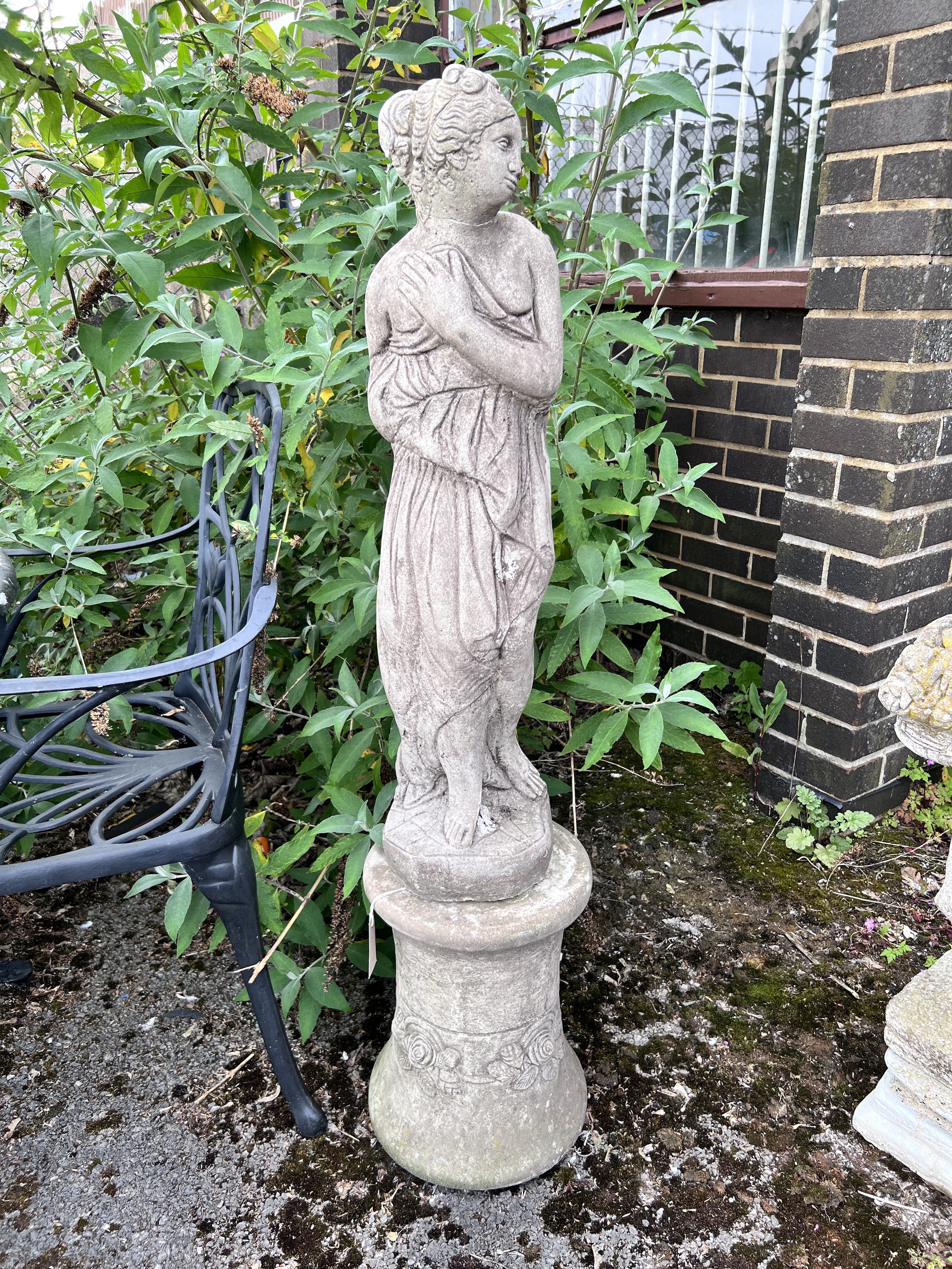 A reconstituted stone classical garden figure of a girl, on pedestal base, height 121cm